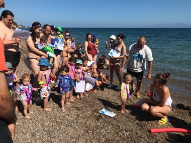 Baby swimming at the see